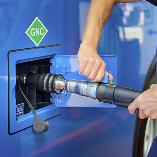 A man recharges a vehicle with compressed natural gas fuel, ecol