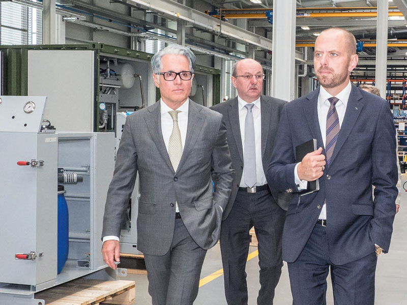   Touring the new production plant: Philipp Bayat, Johann Lesser, Dr. Bruch (from left to right)